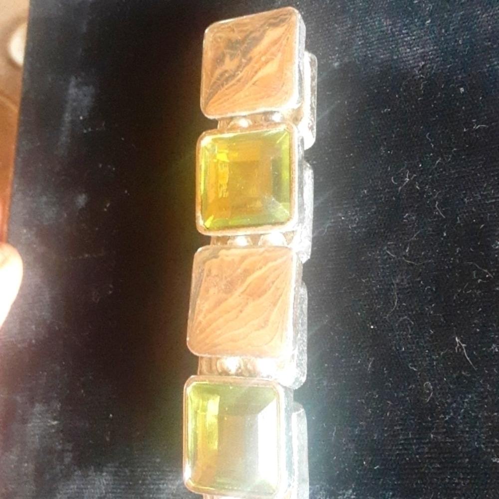 Selling Faux Green Rhinestone, silver plated bracelet.